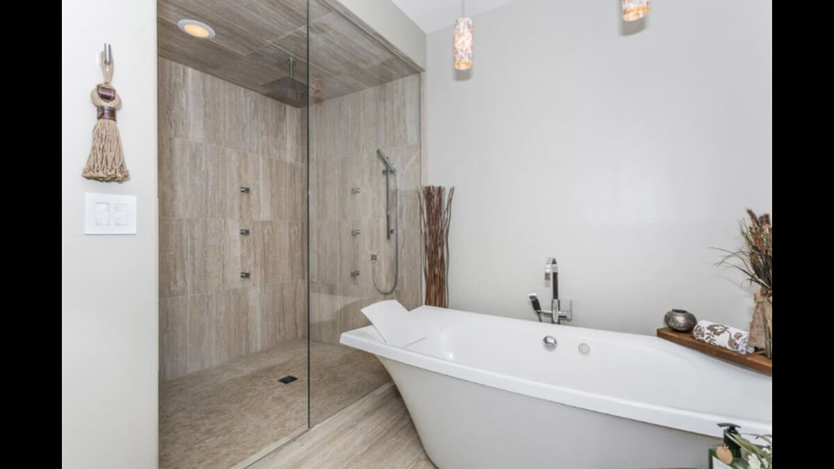 Bathroom with large, tiled shower and soaking tub.